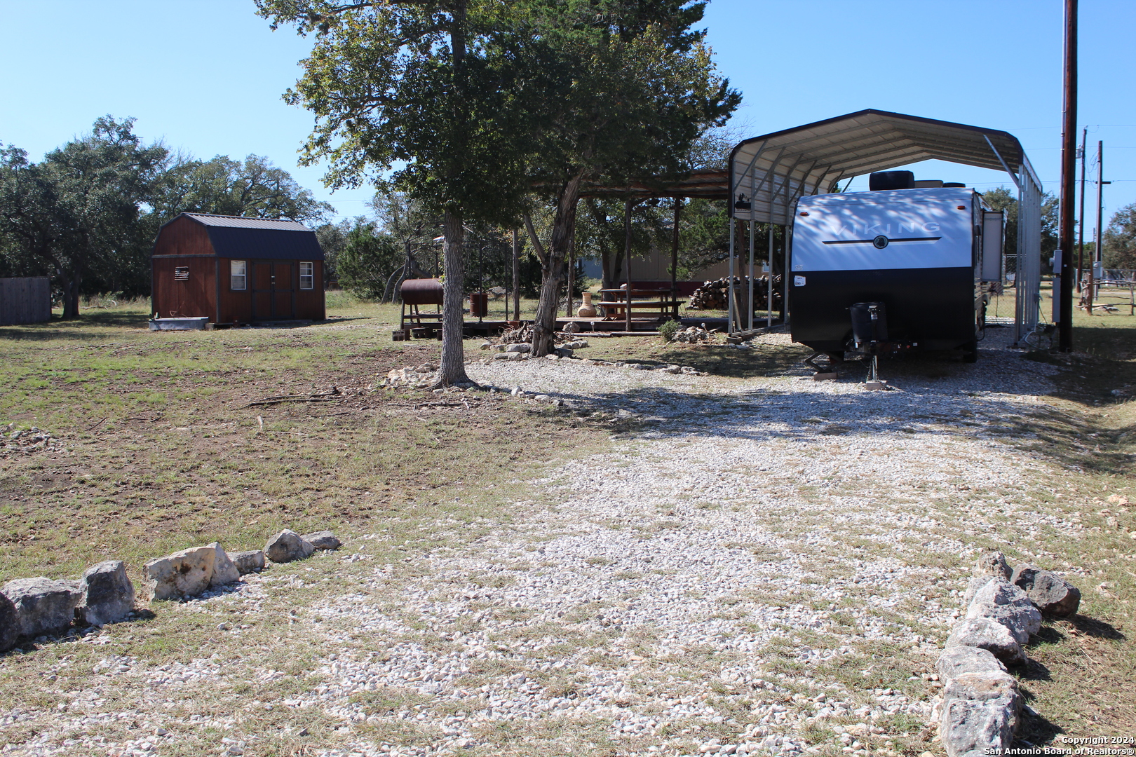 a view of house with outdoor space and sitting area