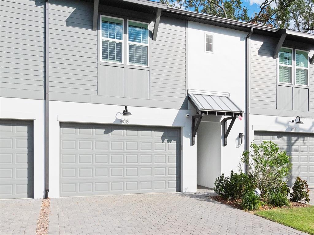 a front view of a house with a garage