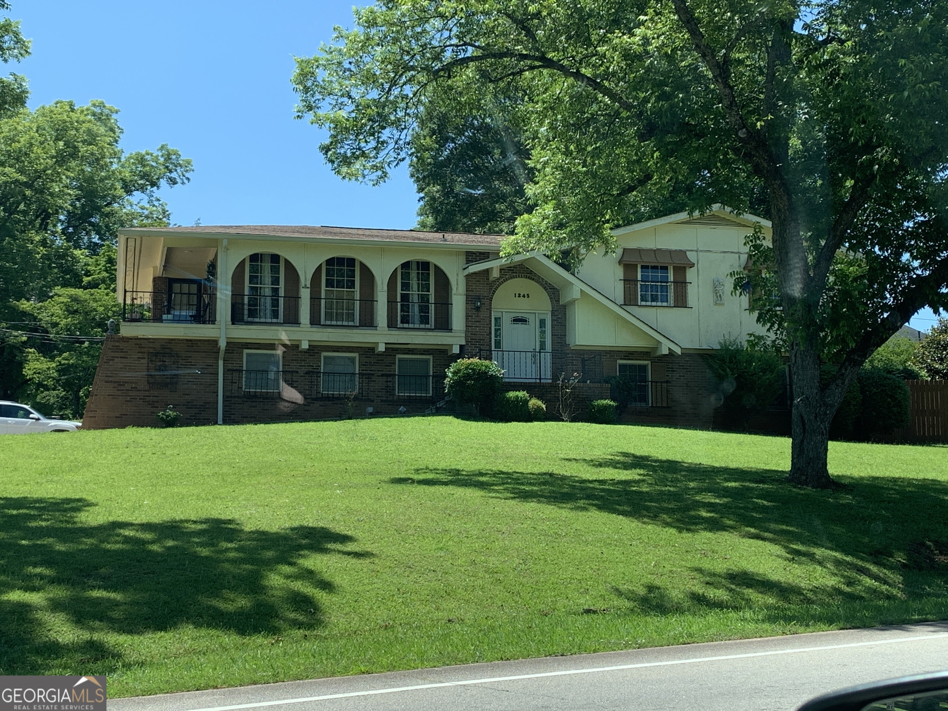 a front view of a house with a yard