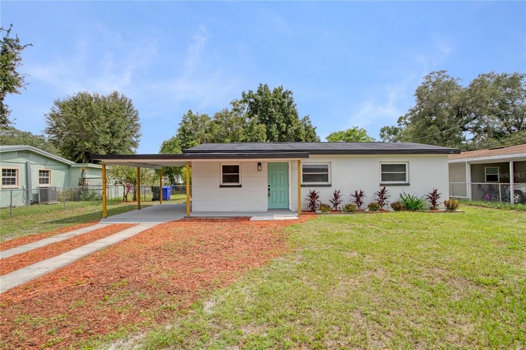 front view of a house with a yard