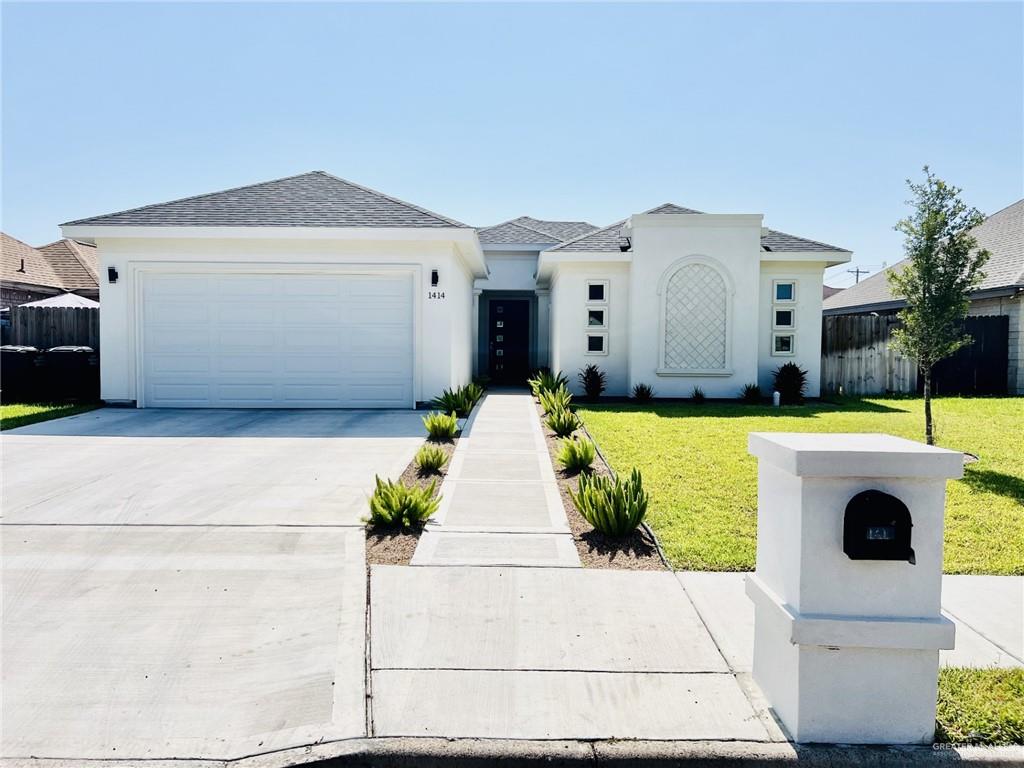 a front view of a house with yard