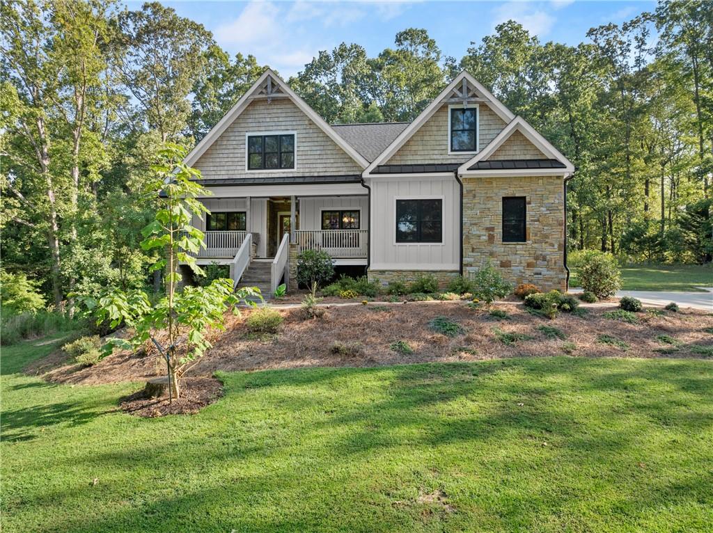 a front view of a house with a yard