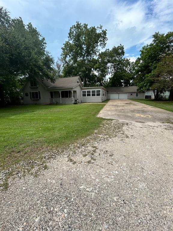 a view of a house with a backyard