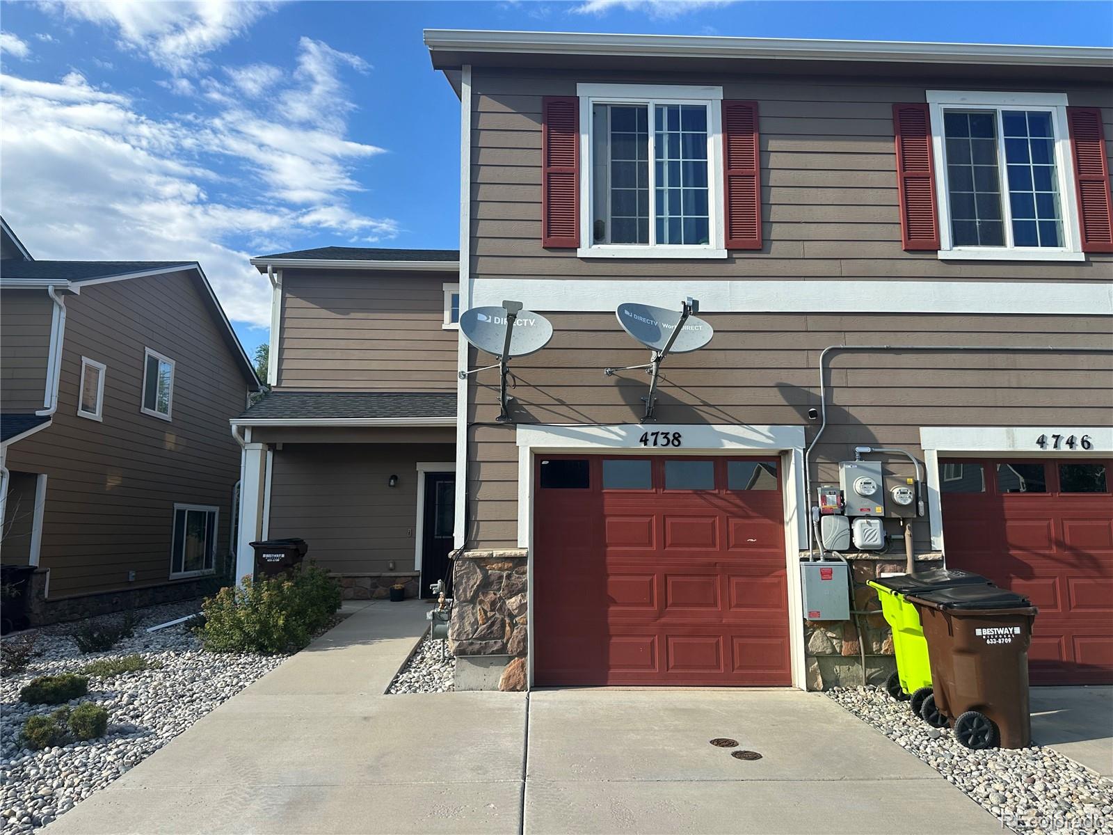 a front view of a house with a garage