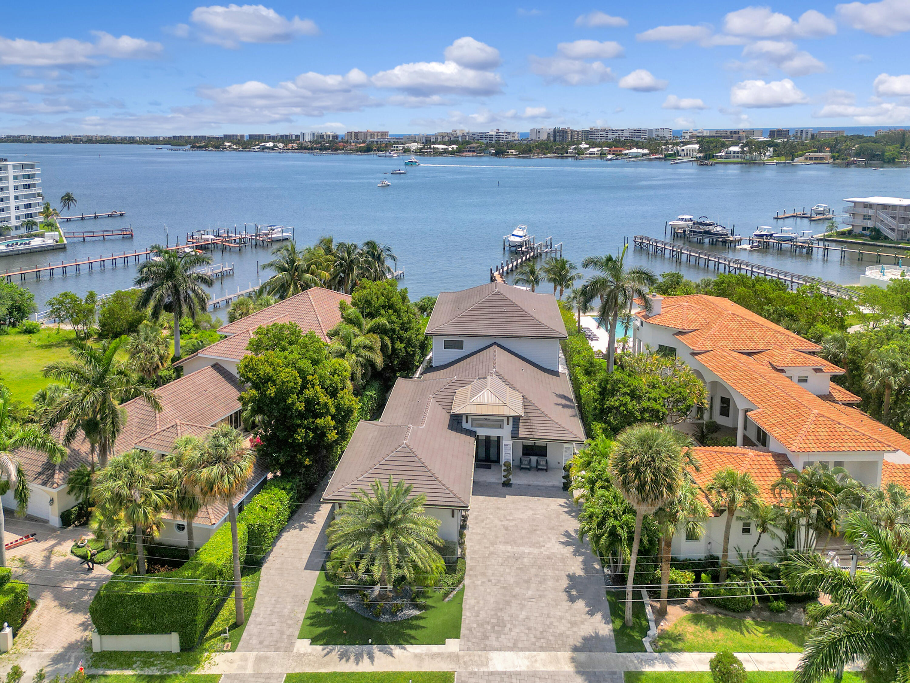 an aerial view of a house with a lake view and mountain view