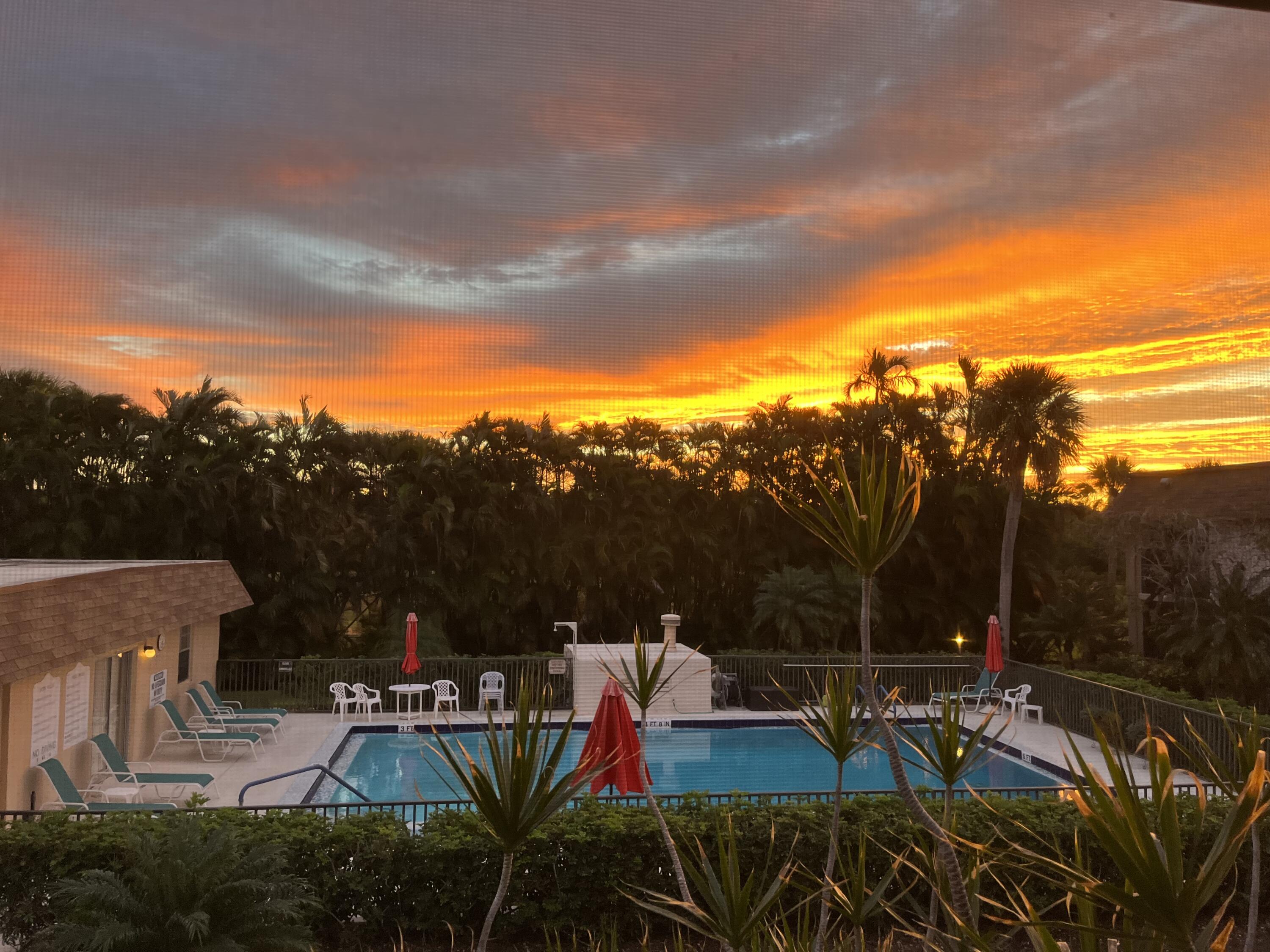 a view of swimming pool with outdoor seating