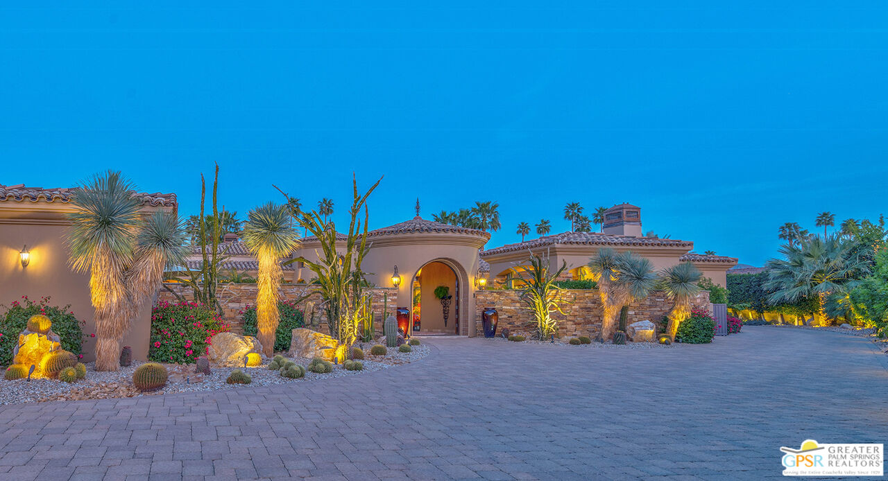 a view of a house with outdoor space and sitting area