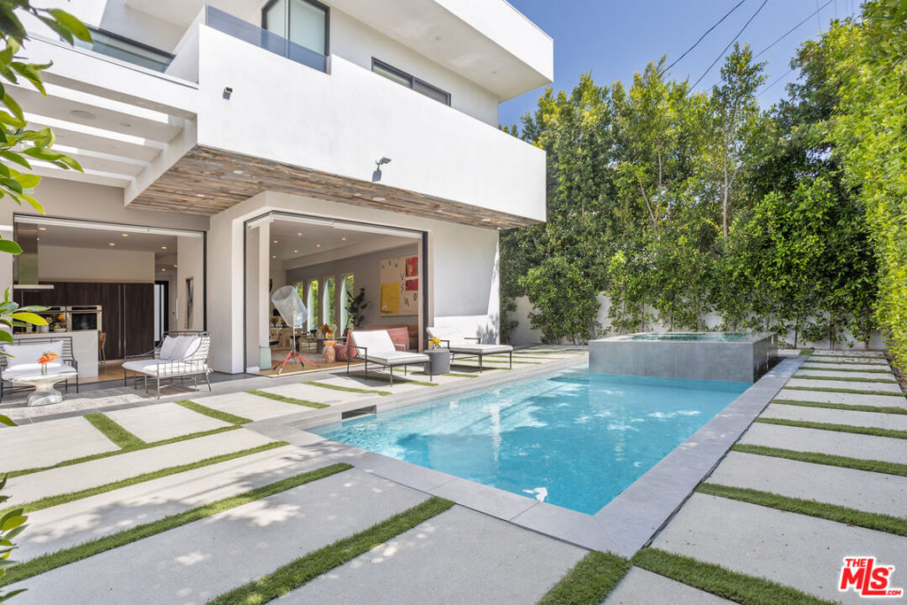 a view of a house with backyard porch and patio