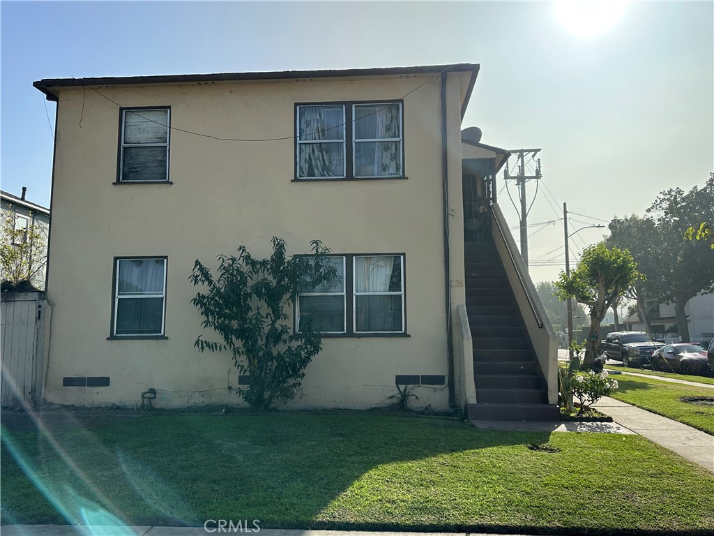 a house that has a plant in front of it