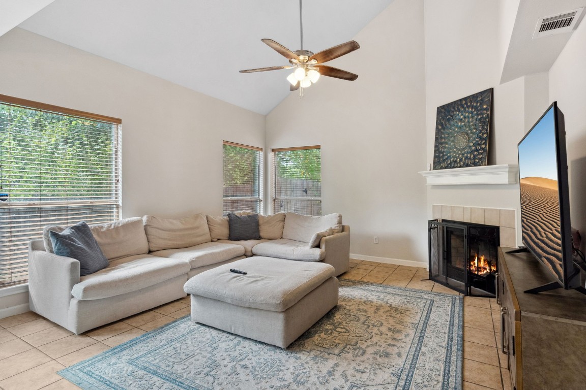 a living room with furniture and a fireplace