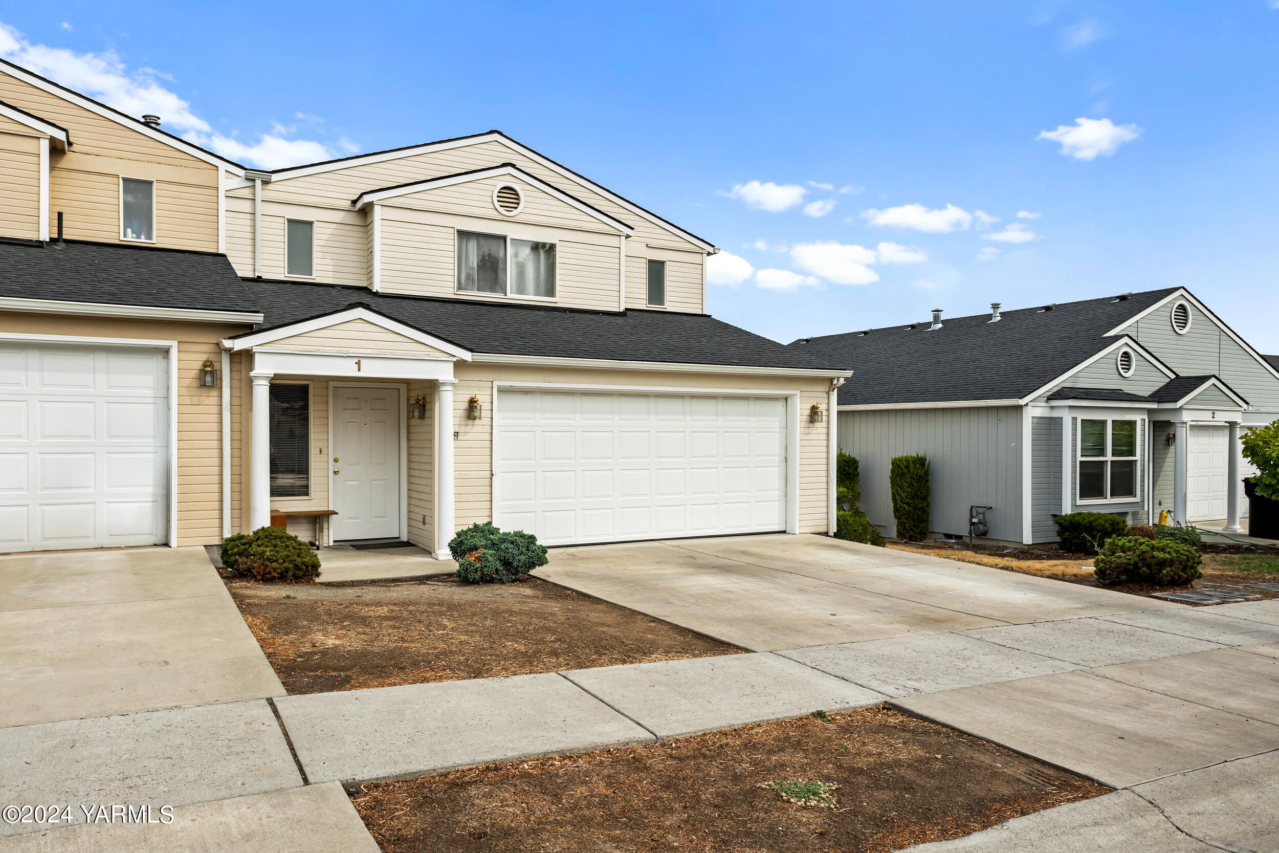 a front view of a house with yard