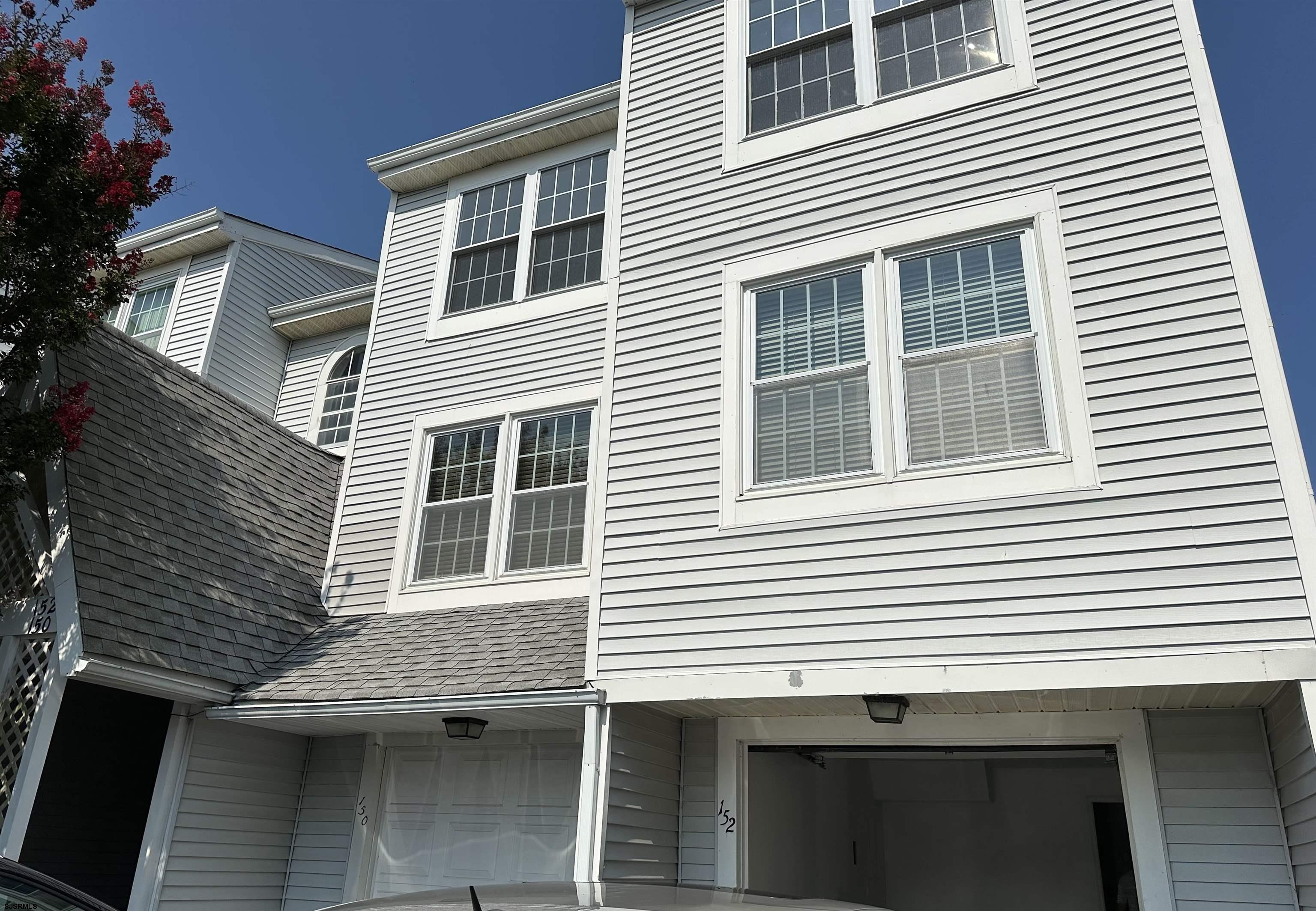 a view of a house with a door and balcony