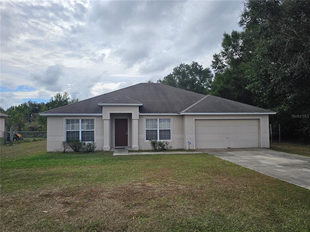 front view of a house and a yard