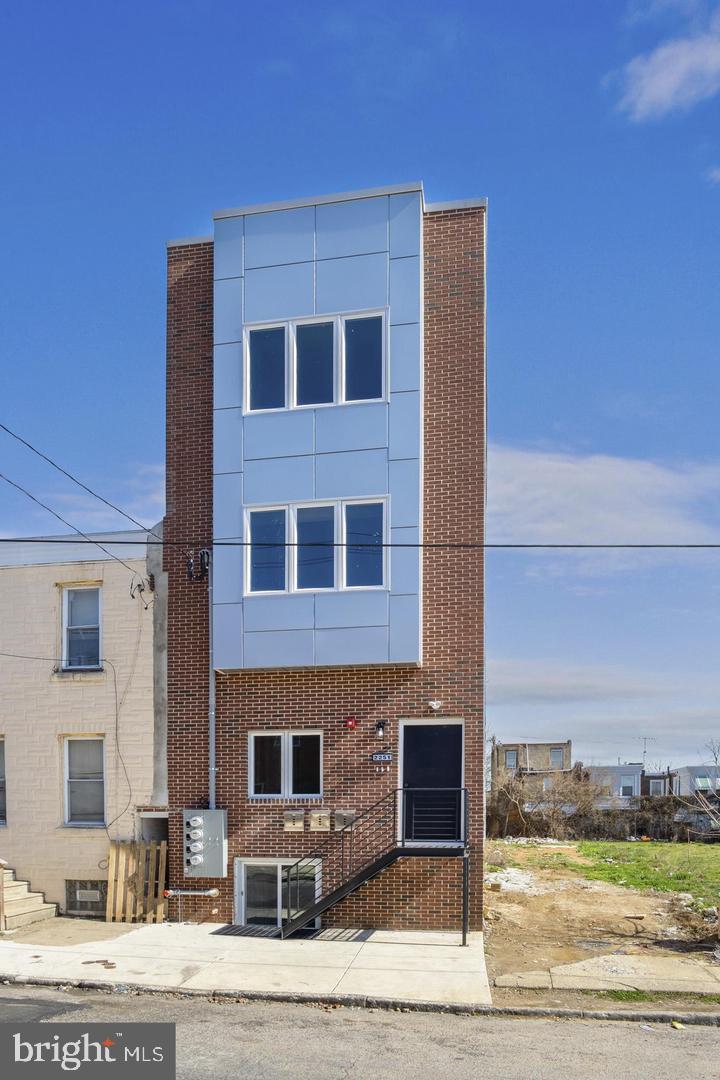 a front view of a building with street view