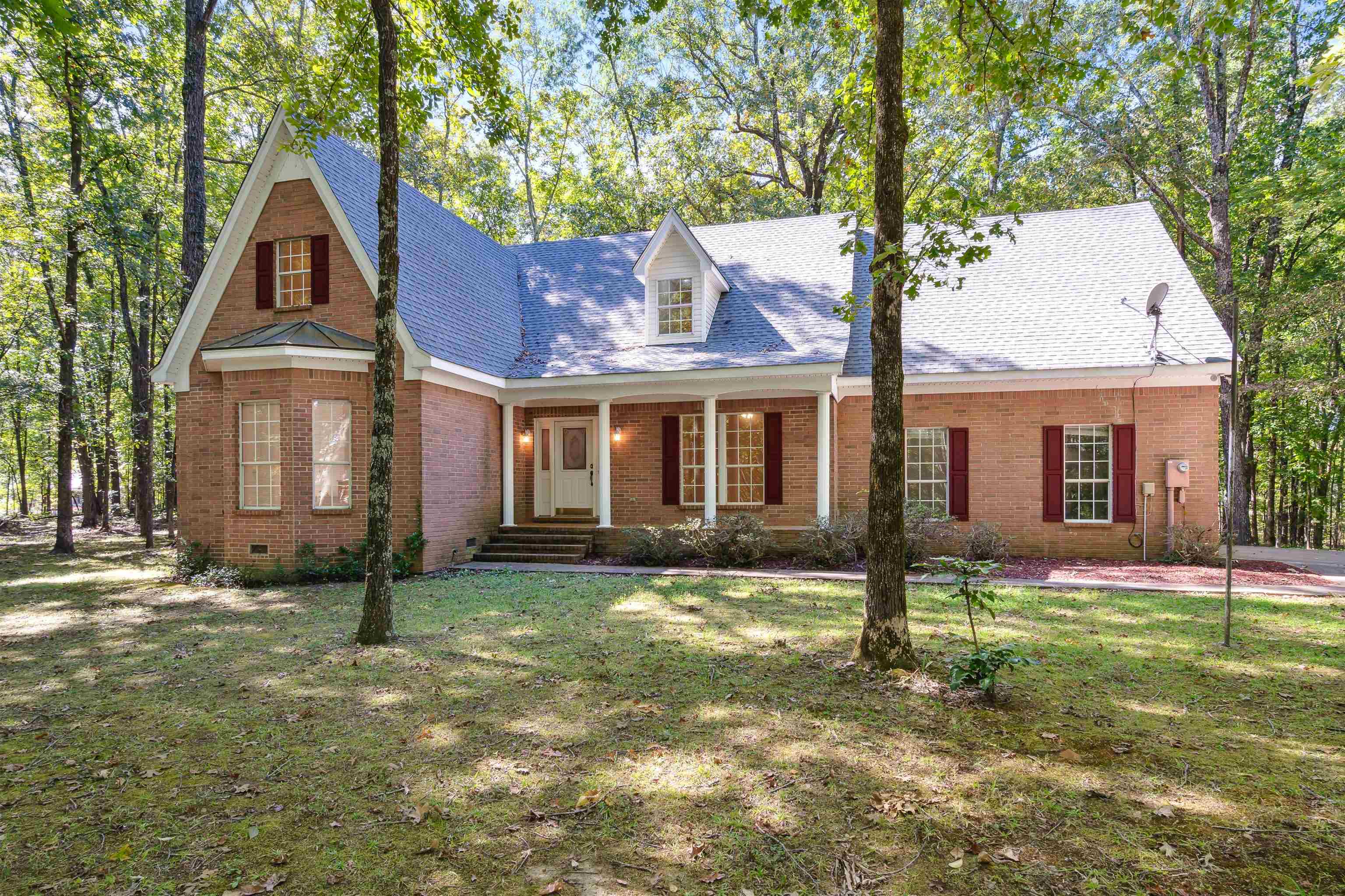 a front view of a house with a yard