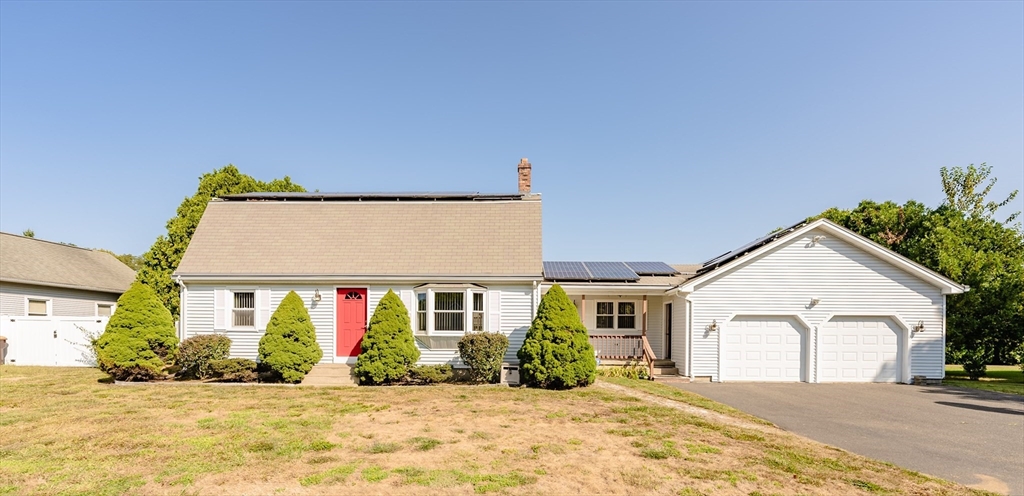 a view of house with yard