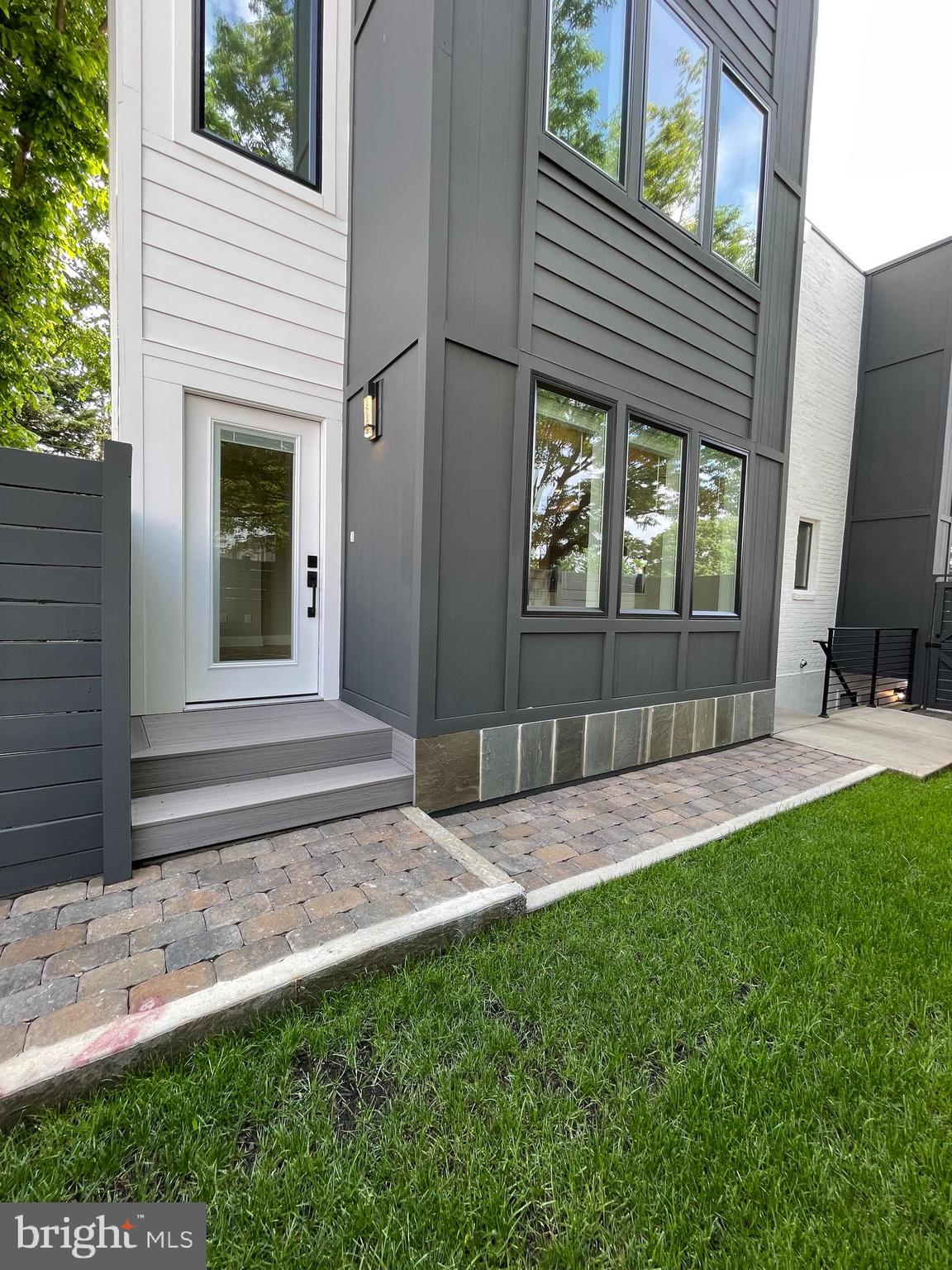 a view of front door of house with yard