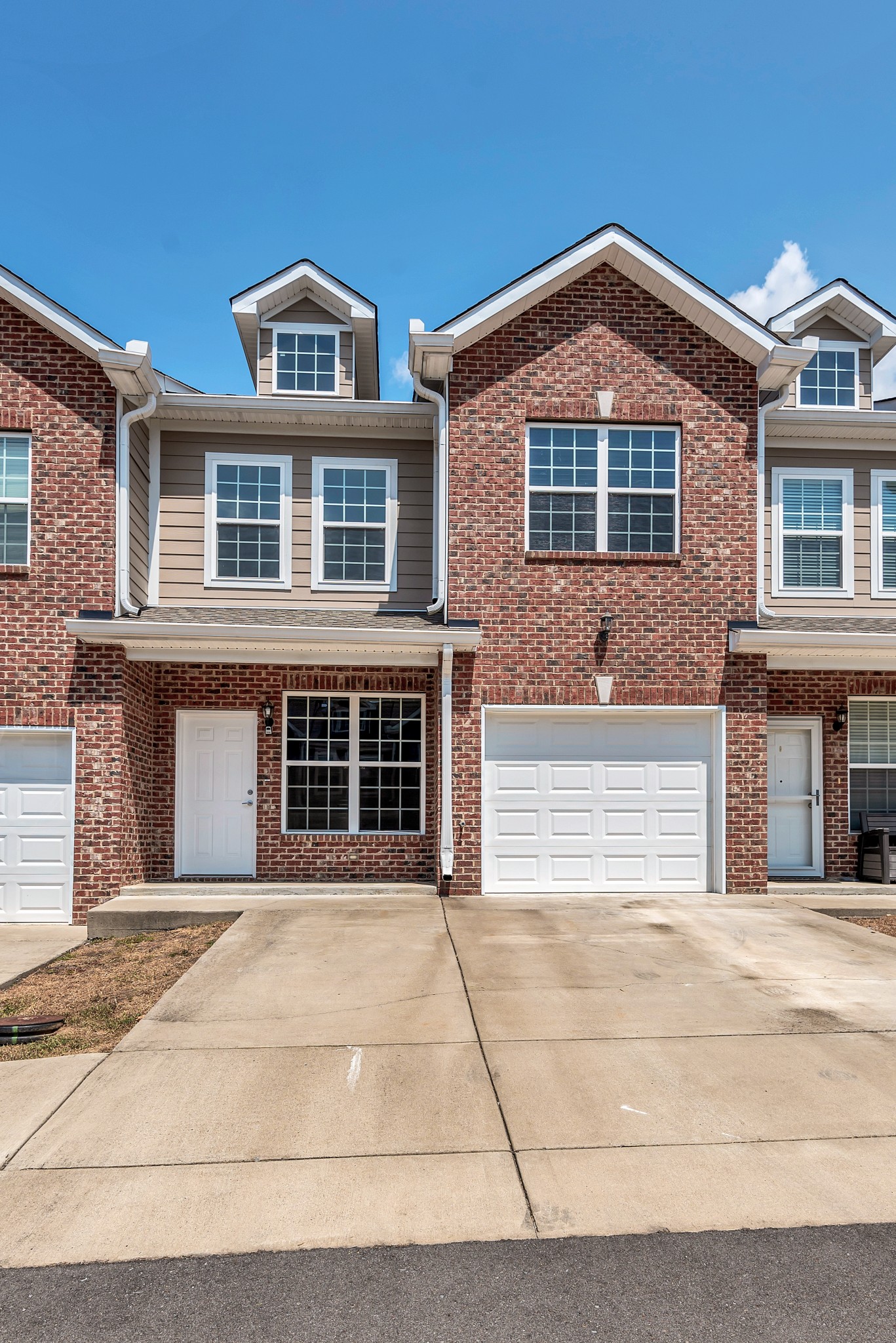 a front view of a house with a garage