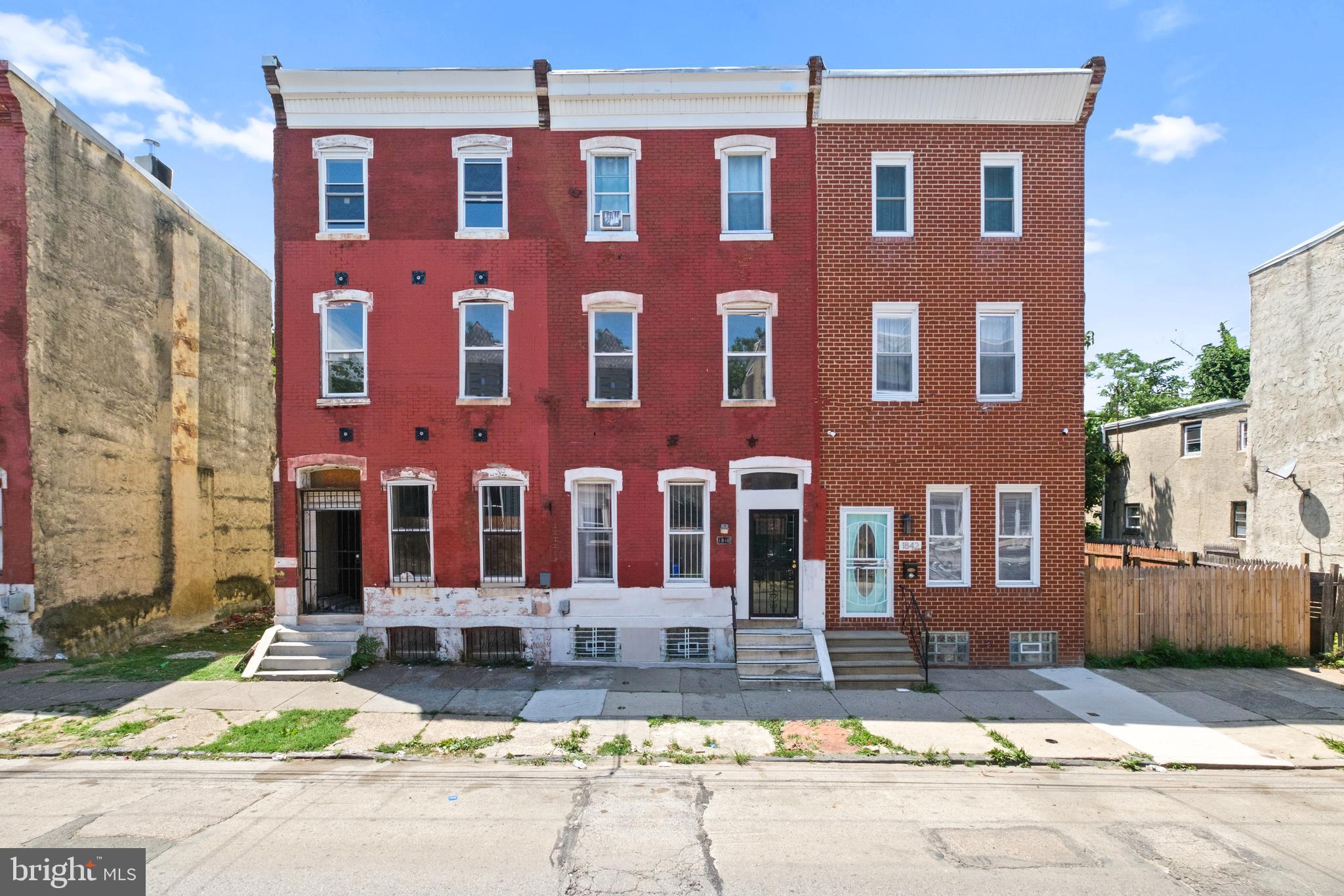 a view of a brick building with many windows