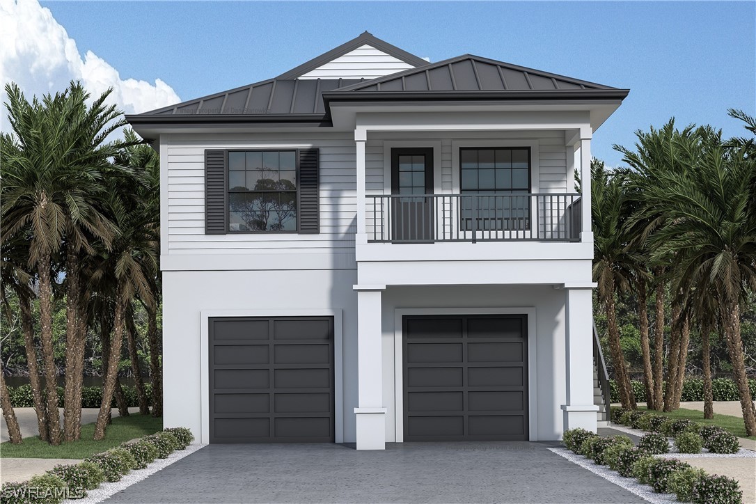 a view of a house with a yard and garage