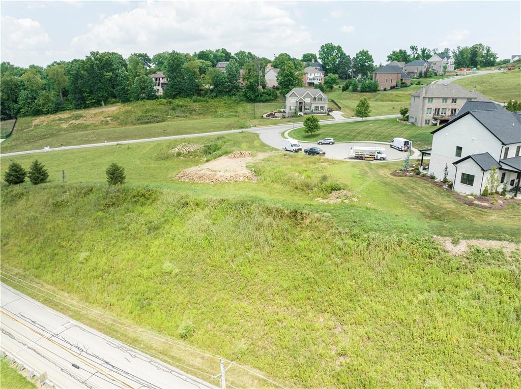 a view of a big yard with an outdoor space