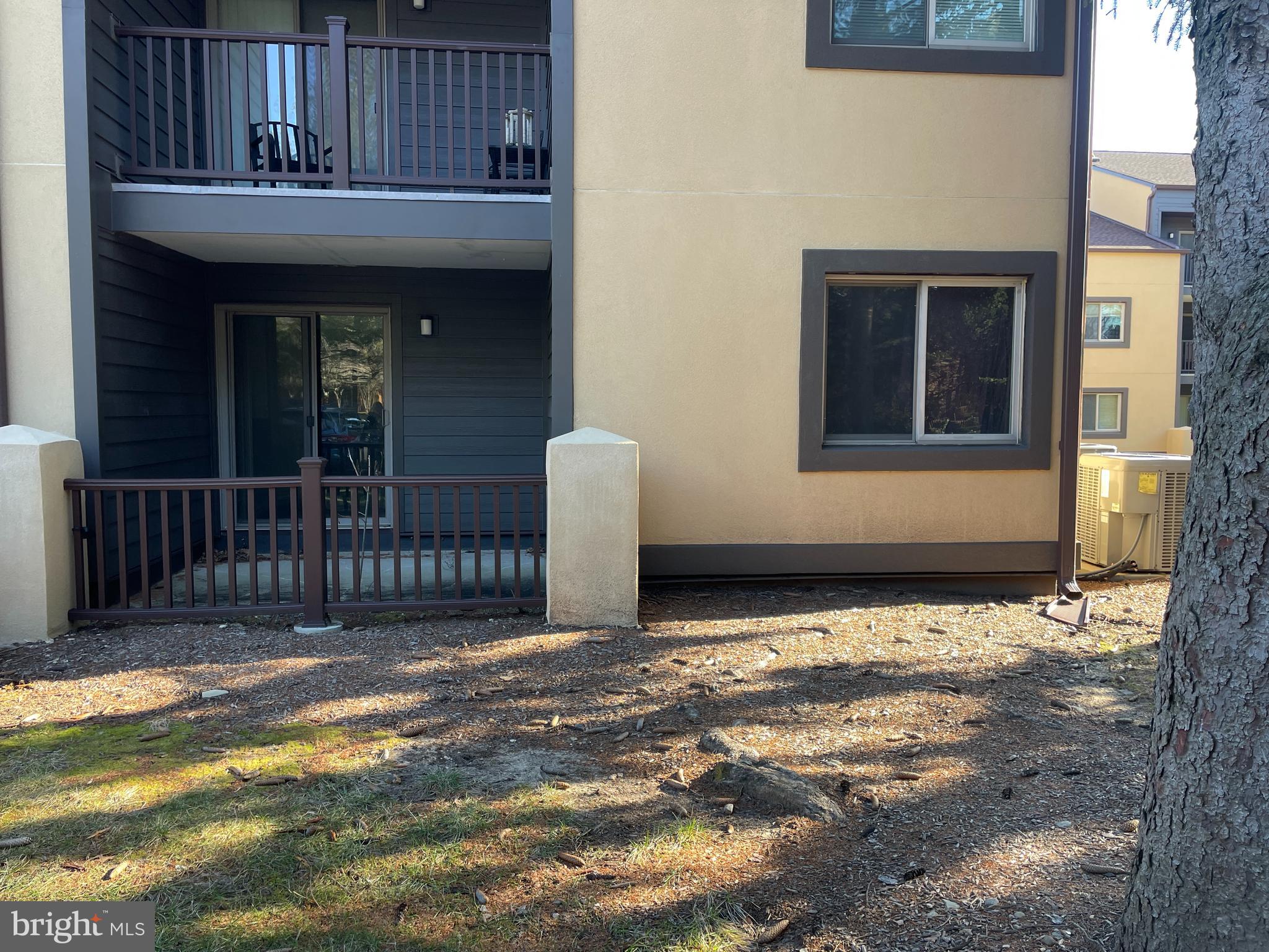 a front view of a house with a fence