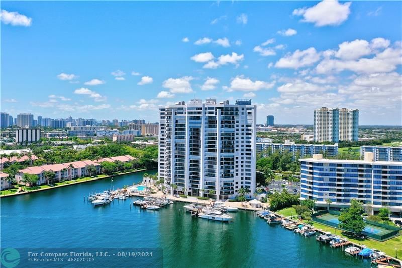 a view of a lake with tall buildings