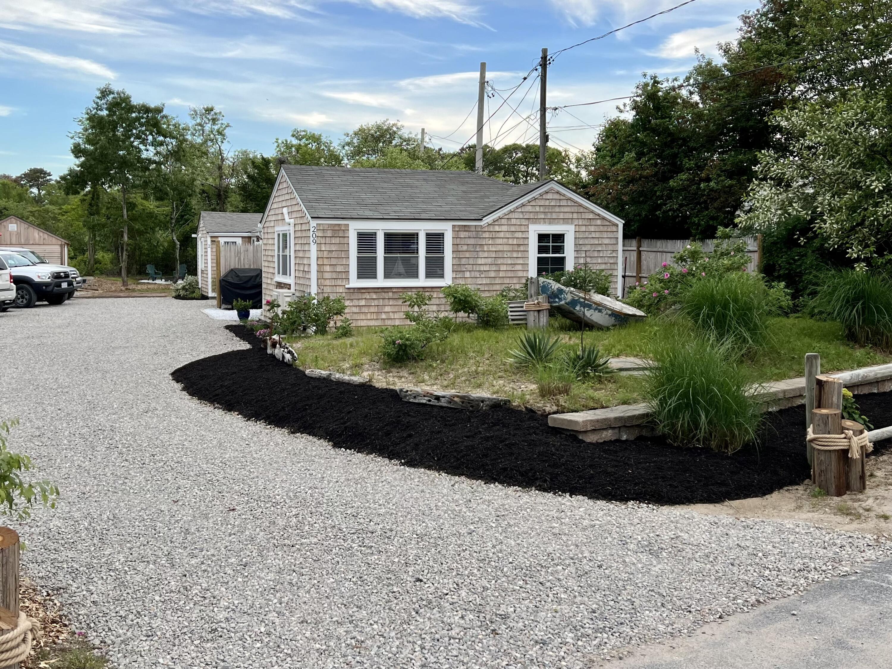 a house view with a garden space