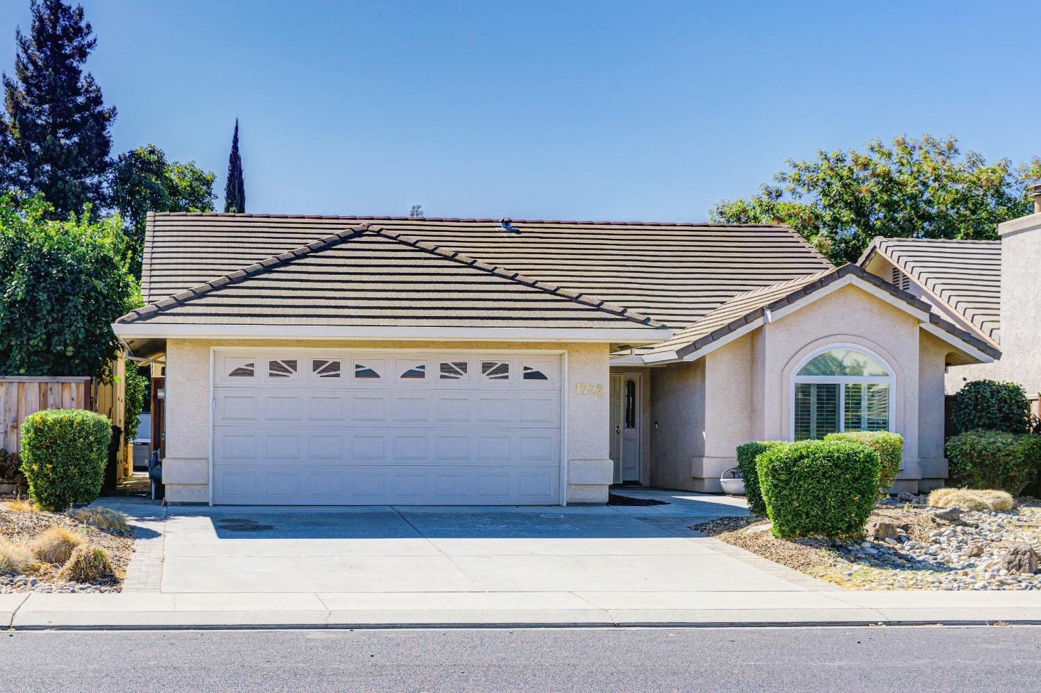 a front view of a house with a garage