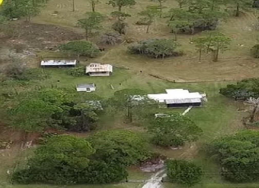 an aerial view of residential house with outdoor space