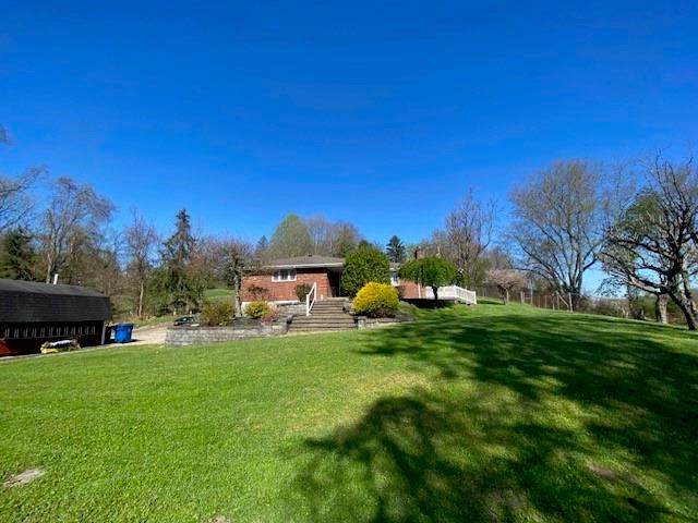 a view of a house with a big yard