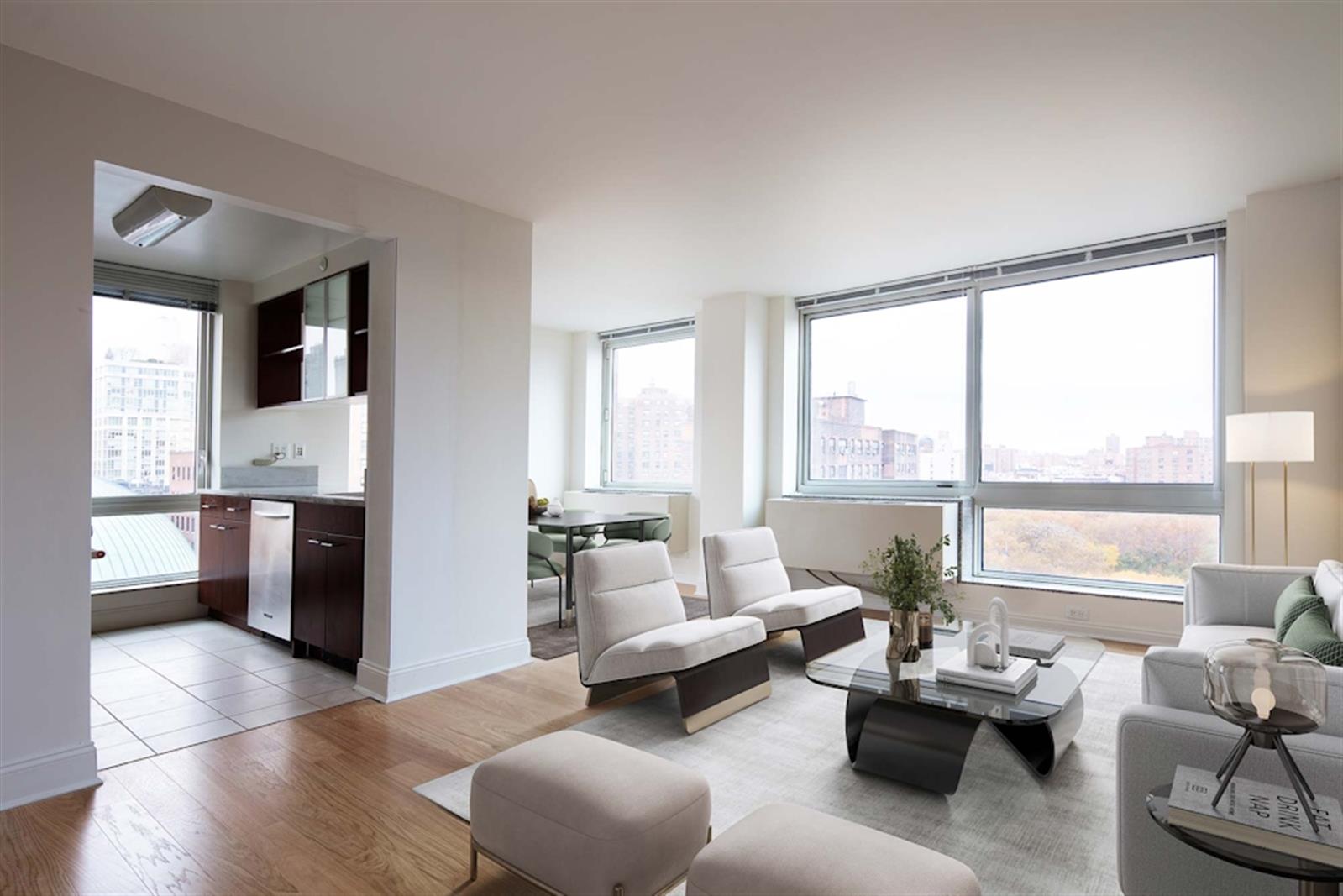 a living room with furniture and large windows