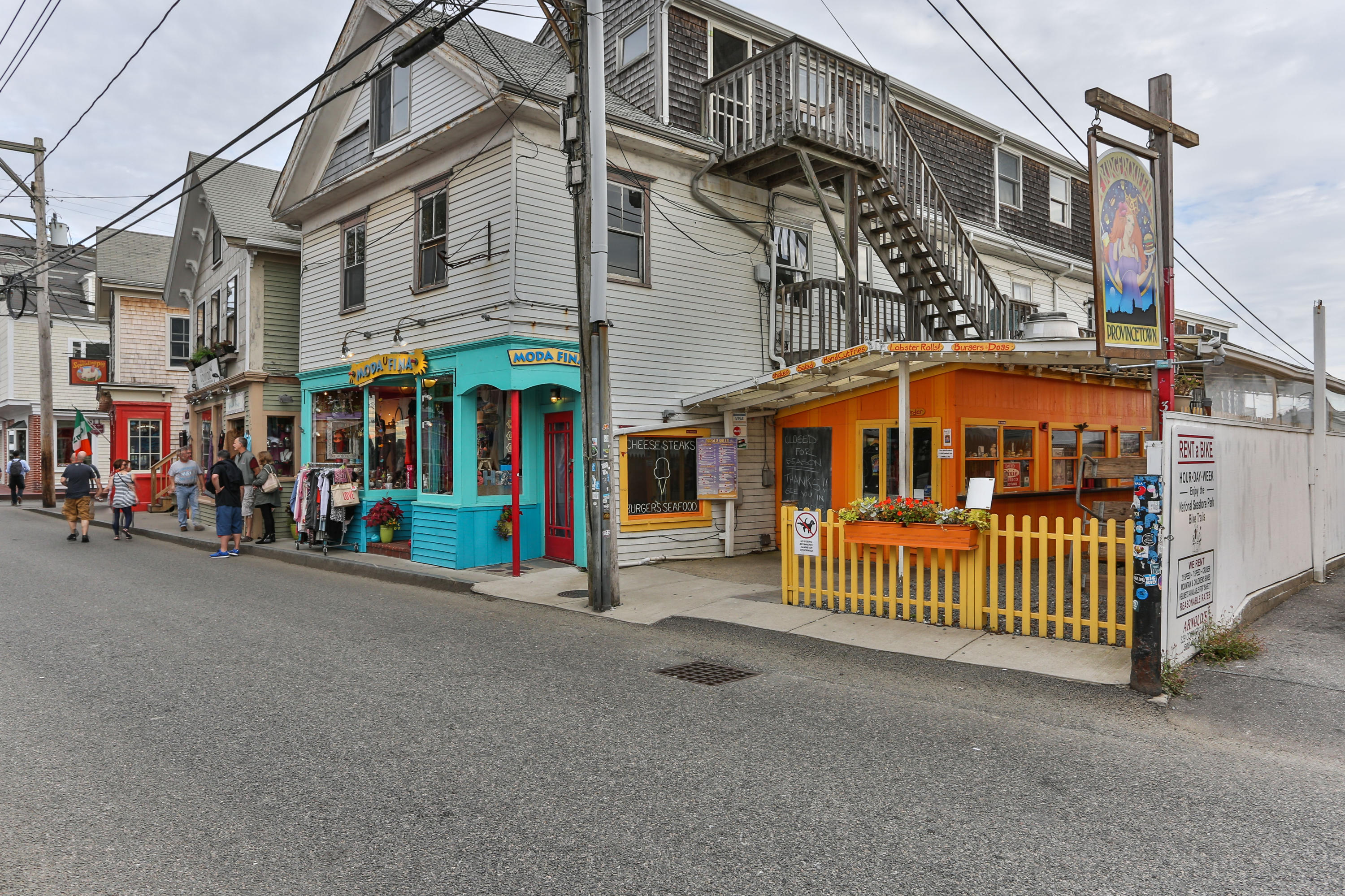 a view of a street with stores