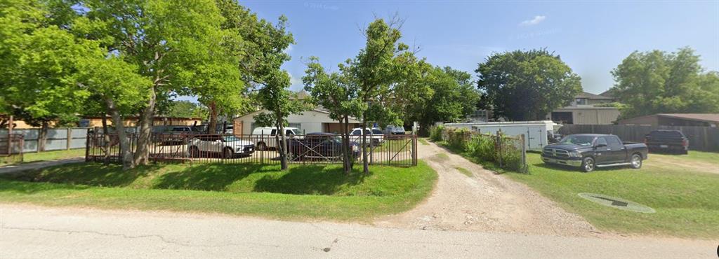 a view of a backyard with sitting area