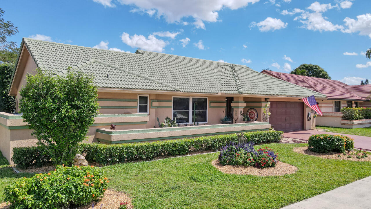 a front view of a house with a yard and porch