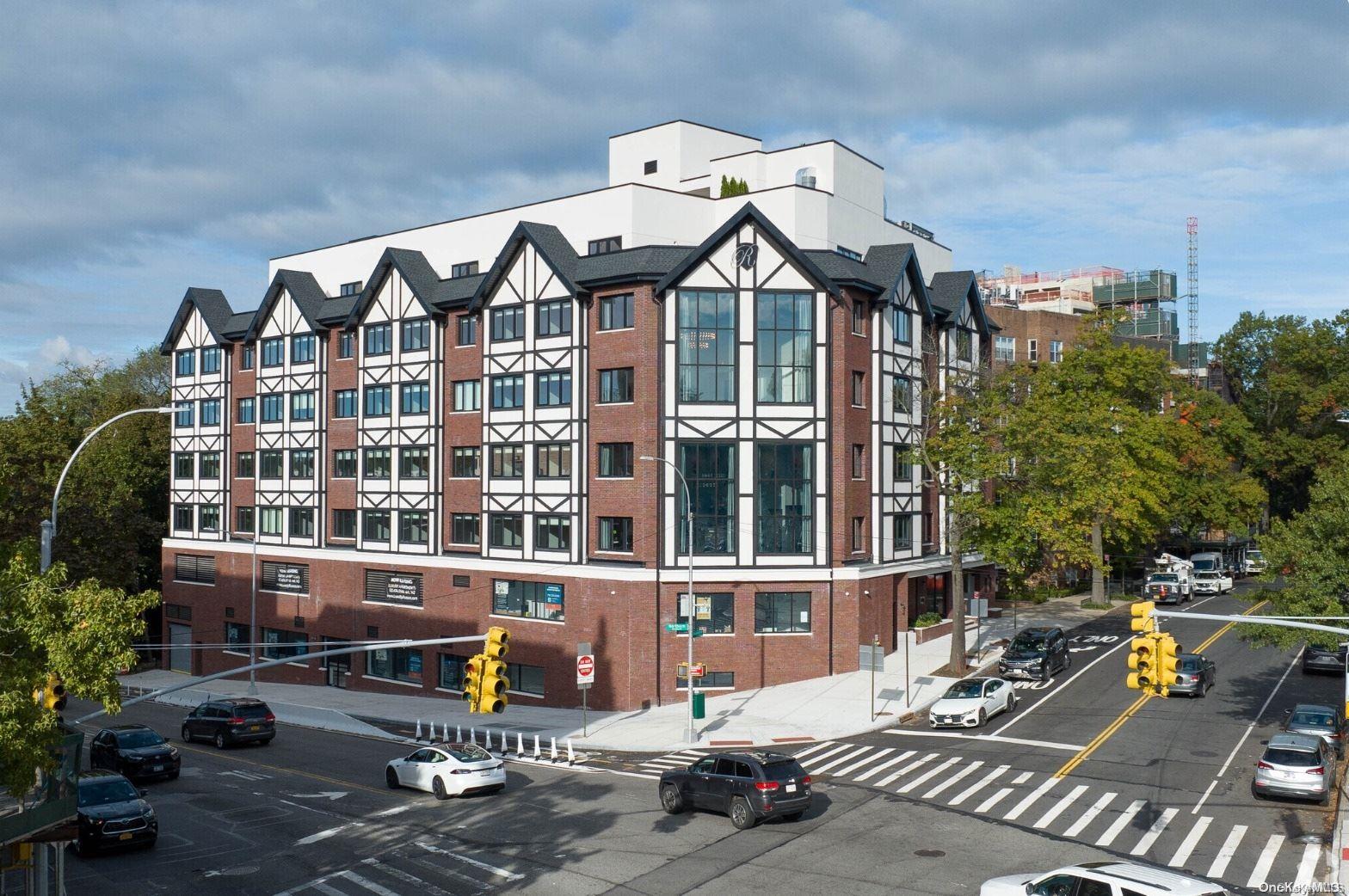 a front view of a building with many windows