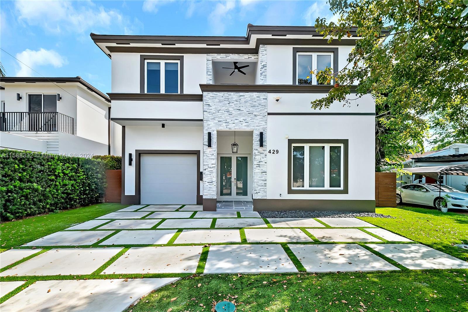 a front view of a house with a yard