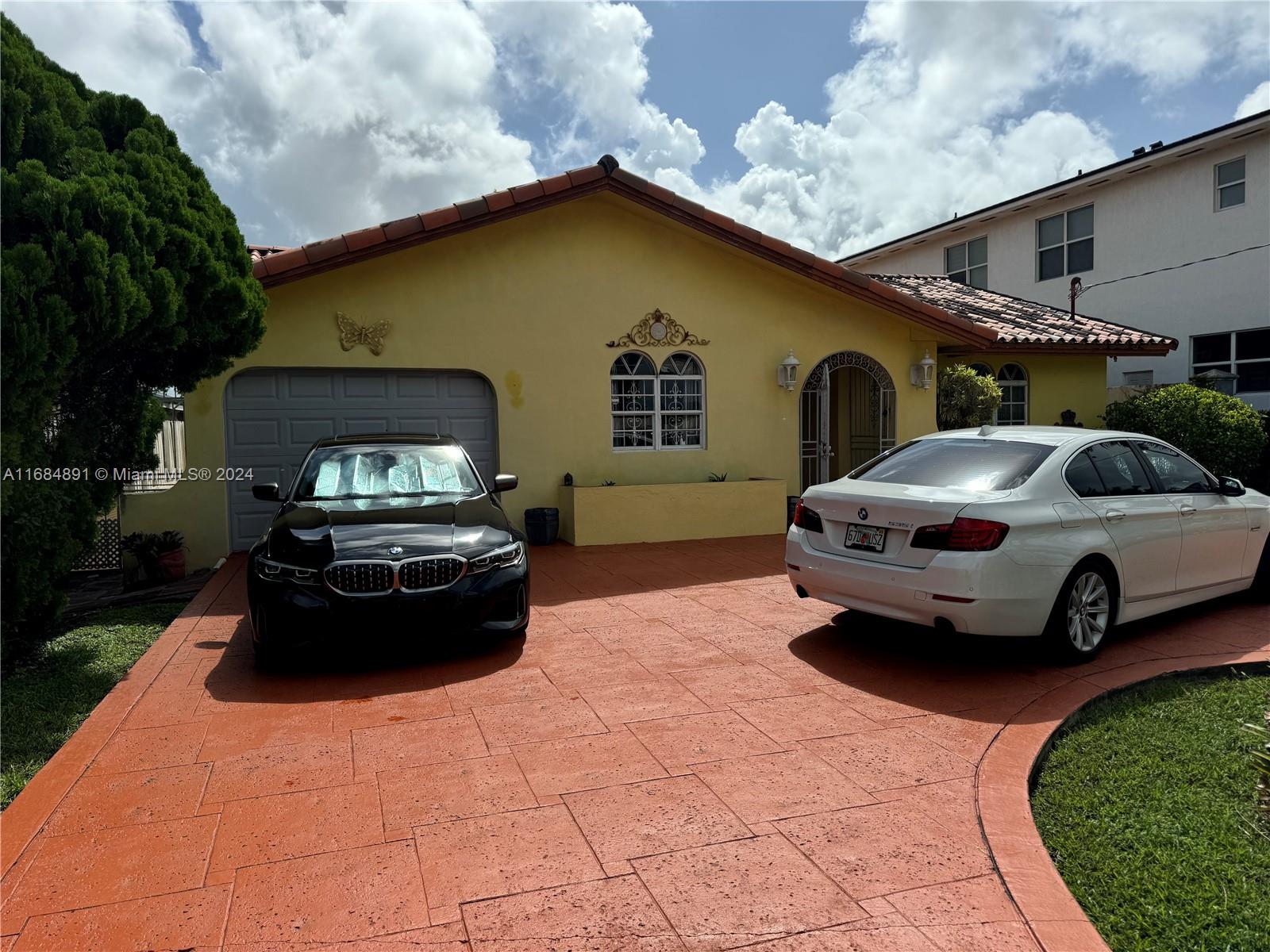 a car parked in front of a house