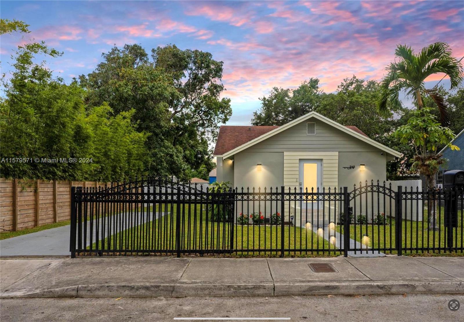 a view of a wrought iron fences in front of house