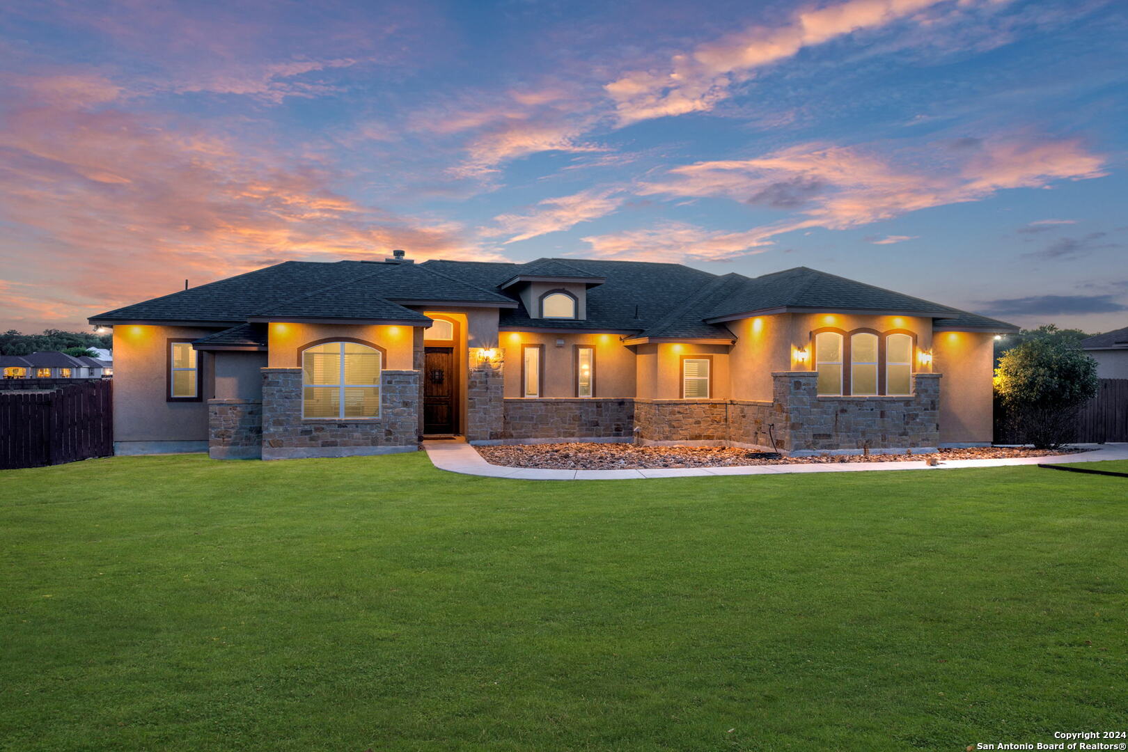 a view of a big house with a big yard