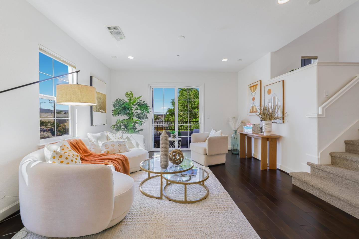 a living room with furniture fireplace and a table