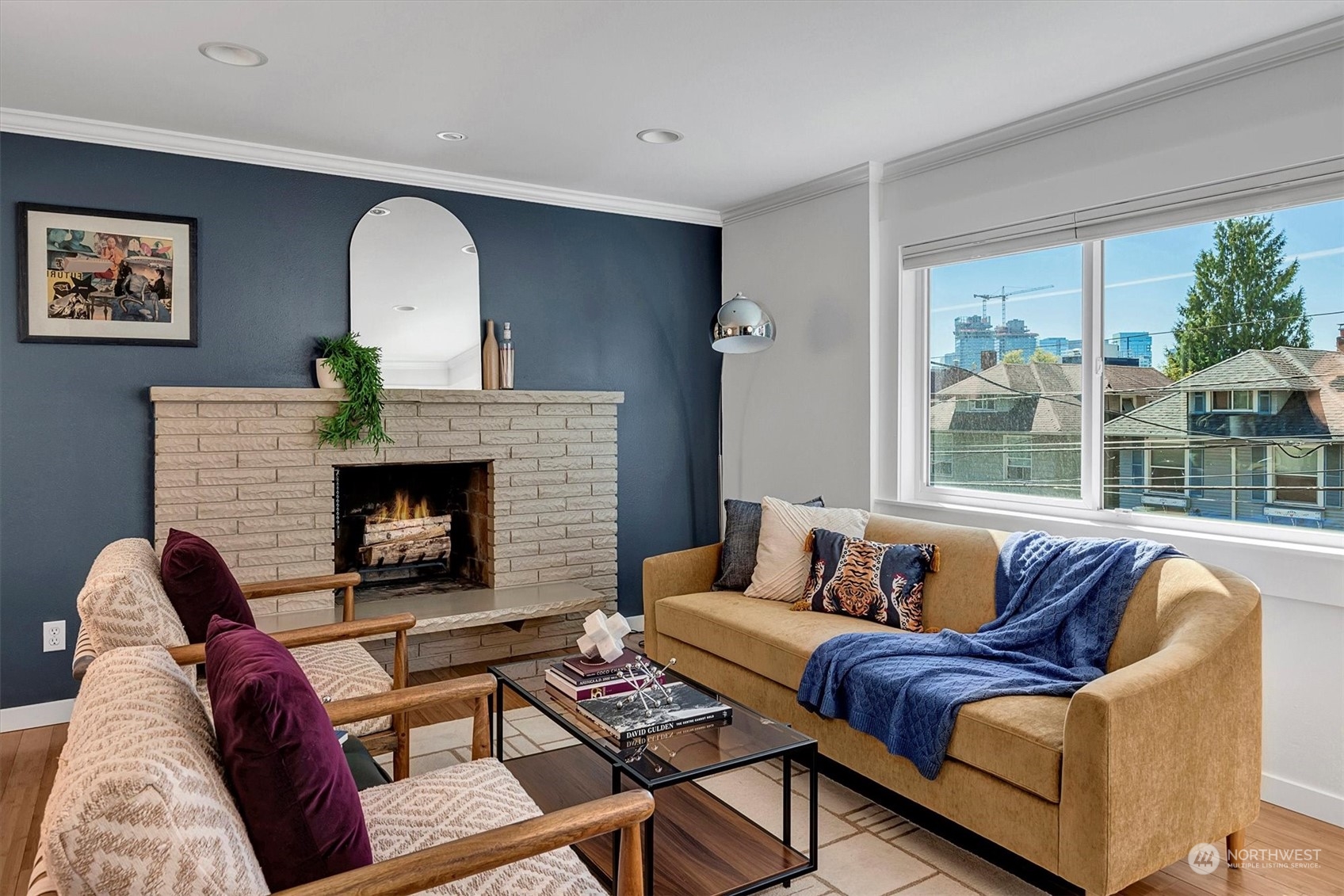 a living room with furniture and a fireplace