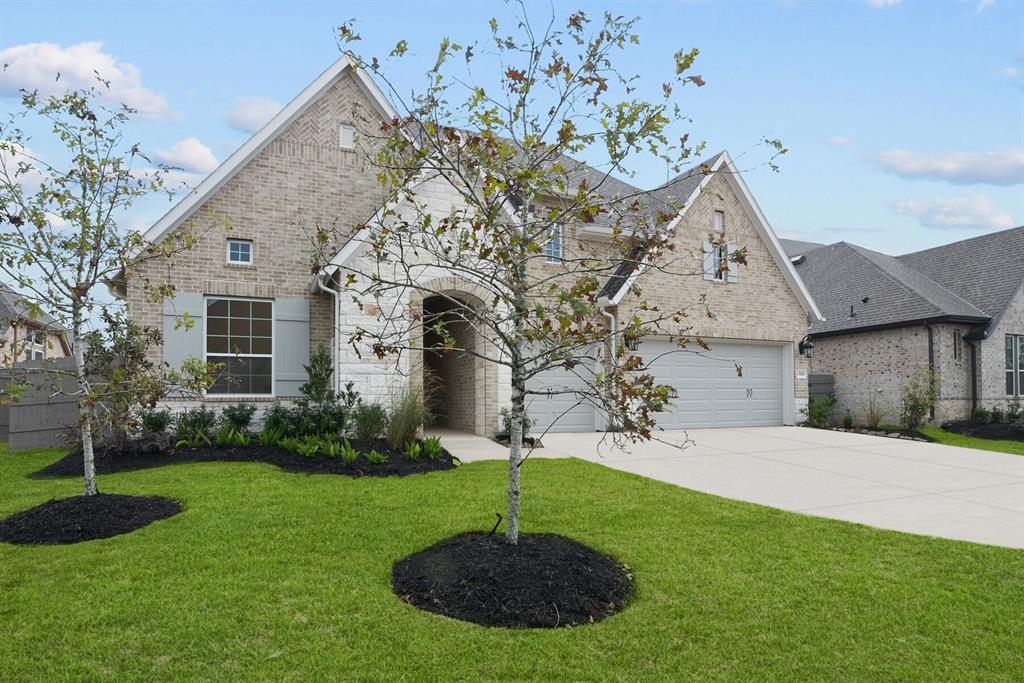 a house with garden in front of it