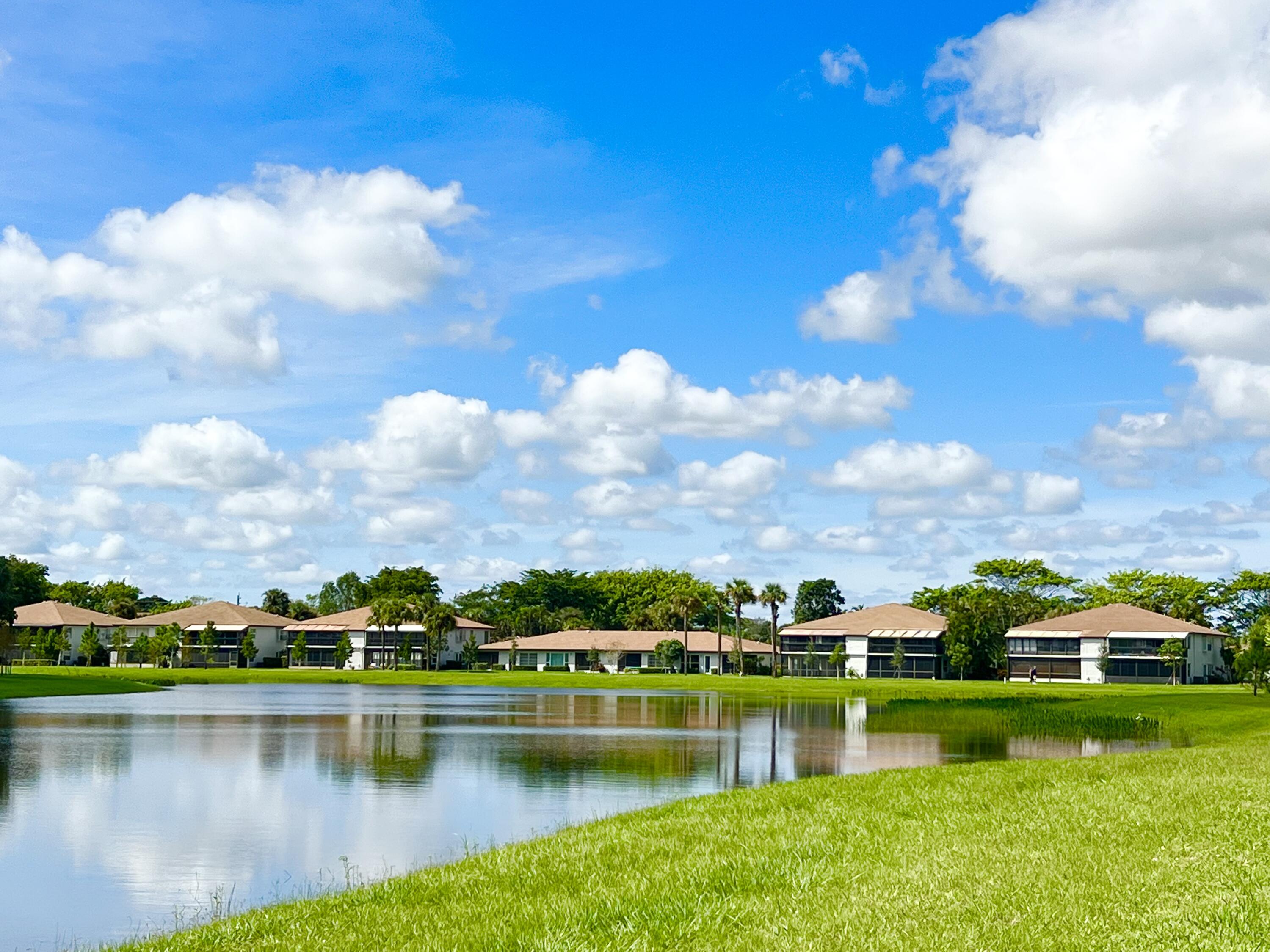 a view of a lake with houses in the back