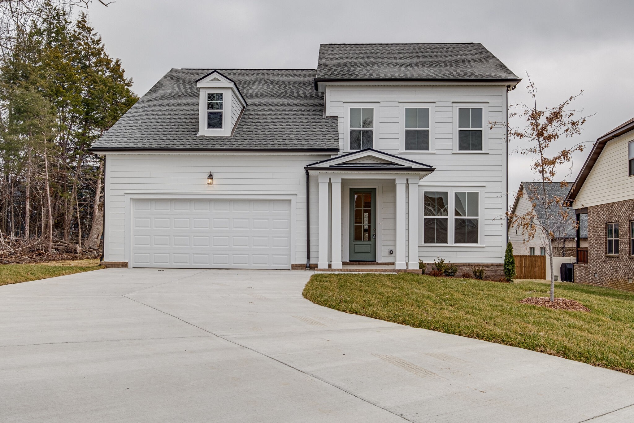 a front view of a house with a yard