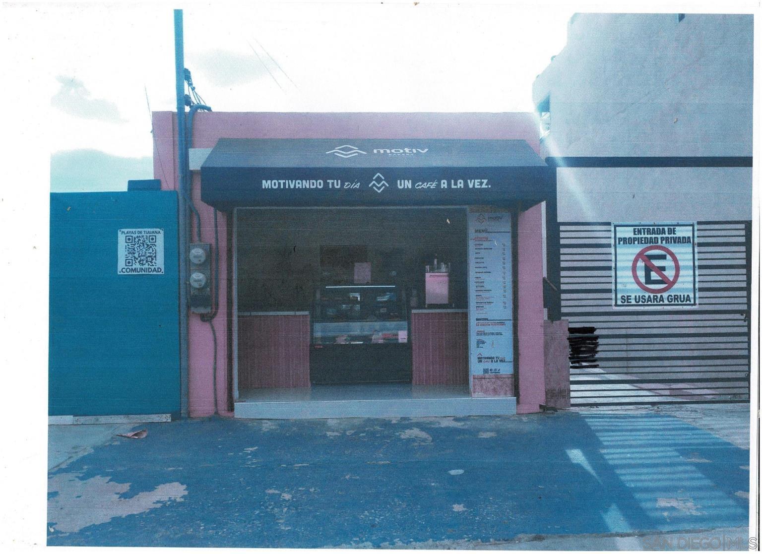 a view of a building with an empty space and entrance