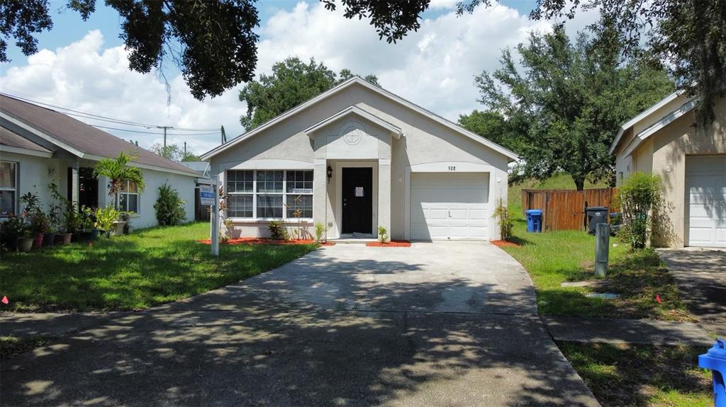 a front view of a house with a yard and porch