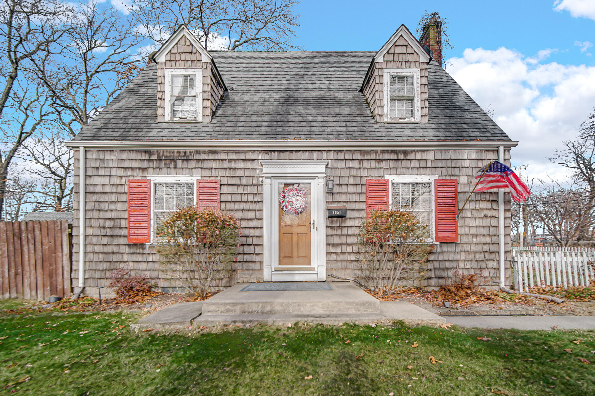 front view of a house with a yard