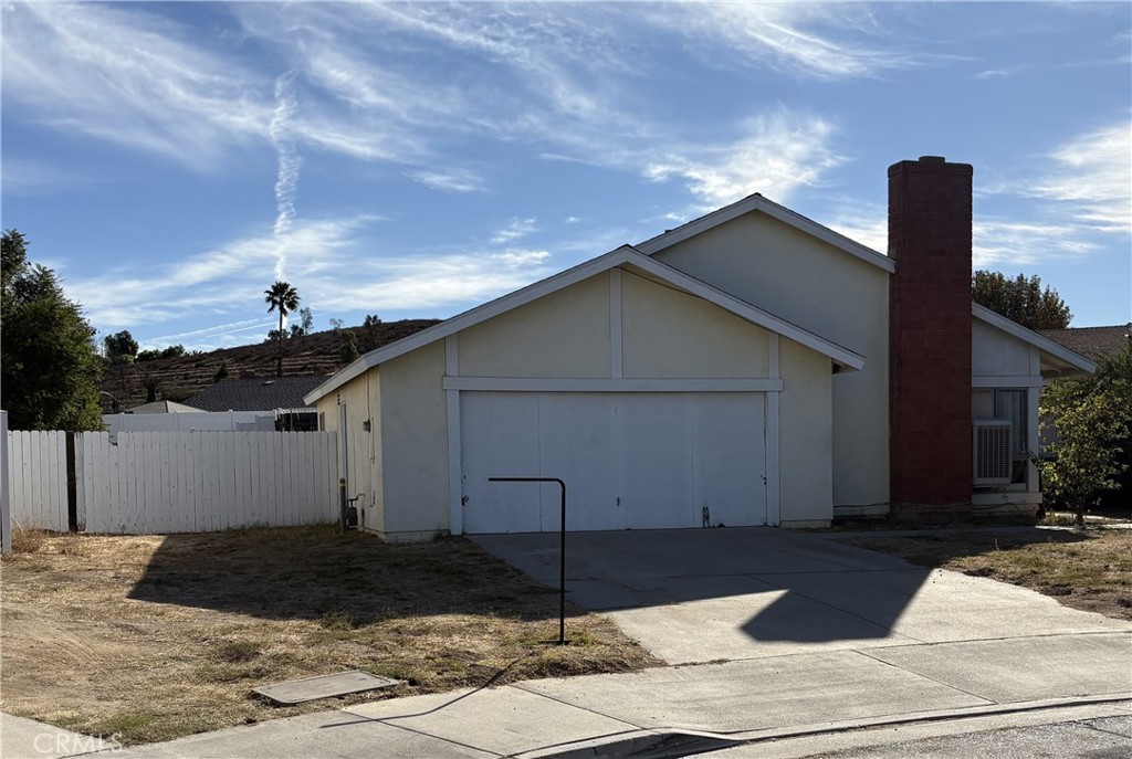 a front view of a house with garage