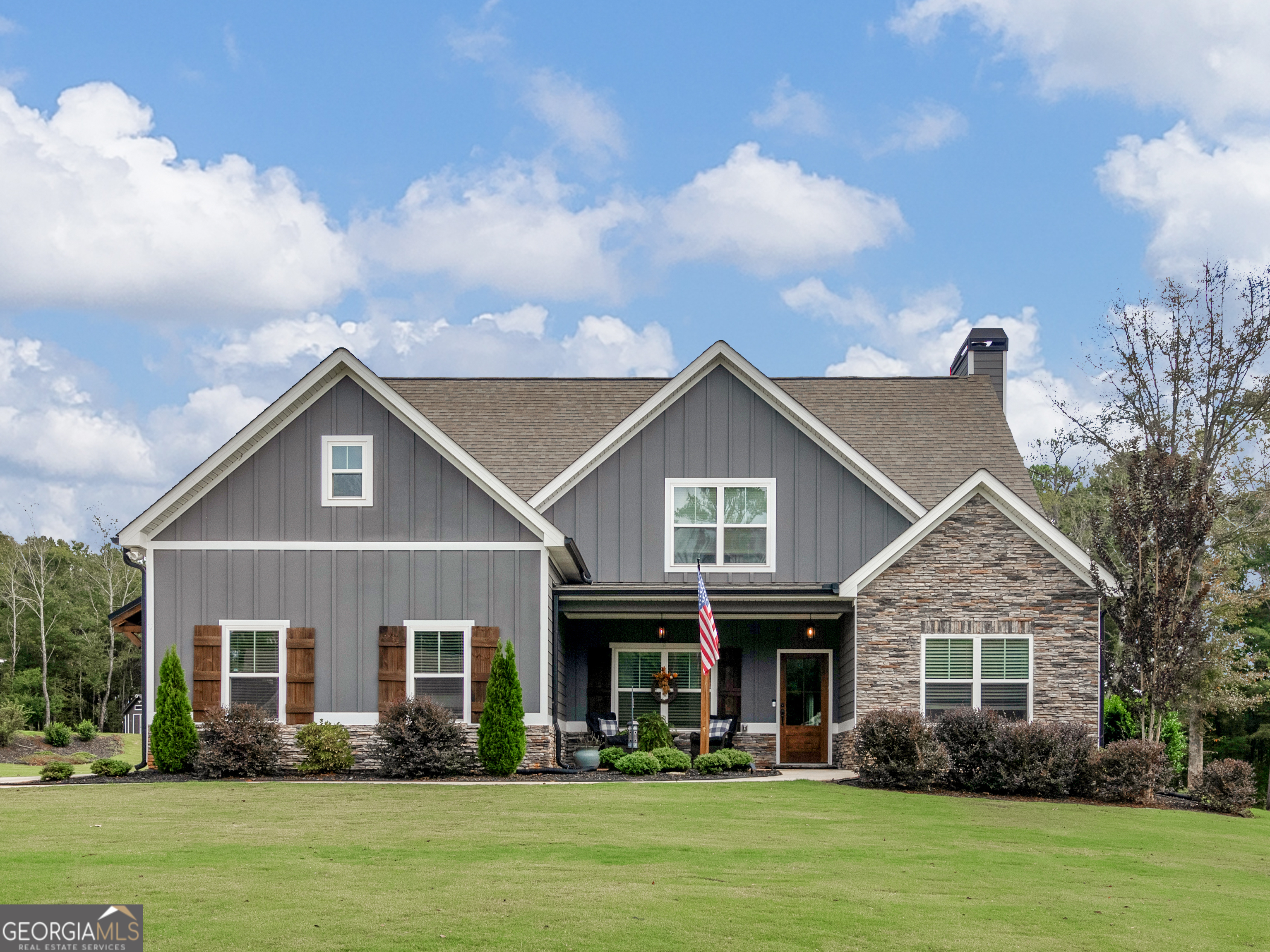 a front view of a house with a yard